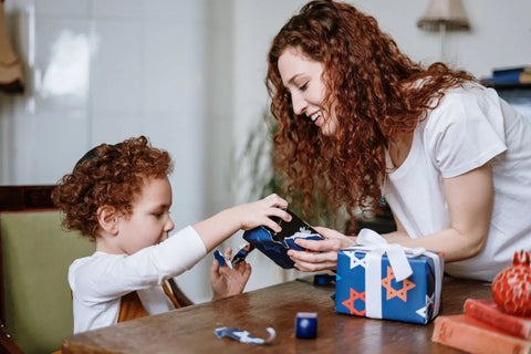 Children unwrapping Christmas presents