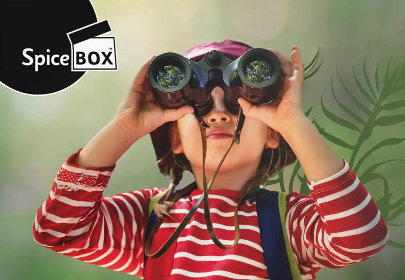 A young child holding a pair of black binoculars.